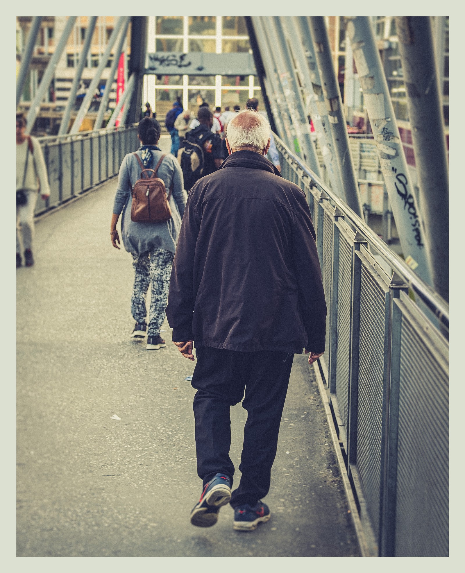 People walking over bridge